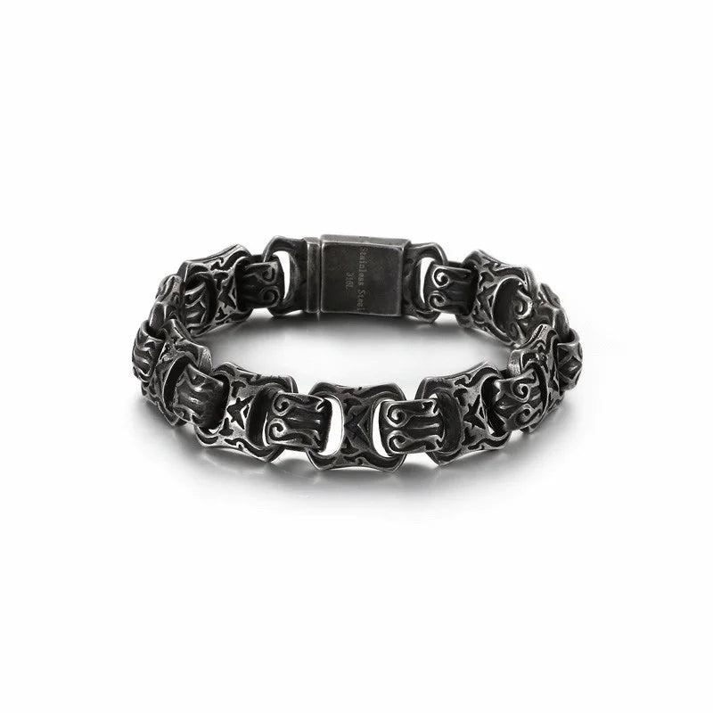 Ornate silver bracelet with intricate chain-like links and a clasp.