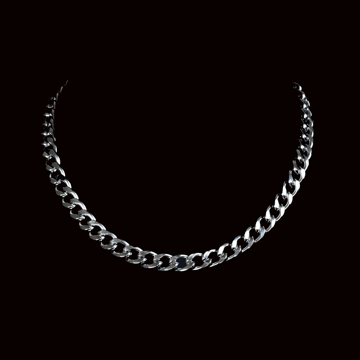 Silver chain necklace with interlocking links.