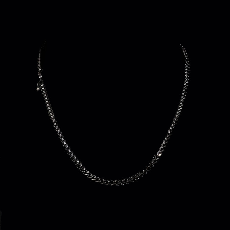 Silver chain necklace with interlocking links.