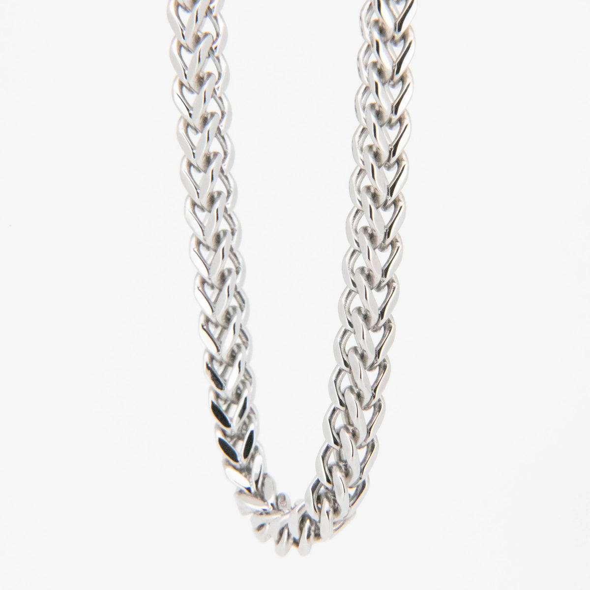 Silver chain necklace with a braided link pattern.