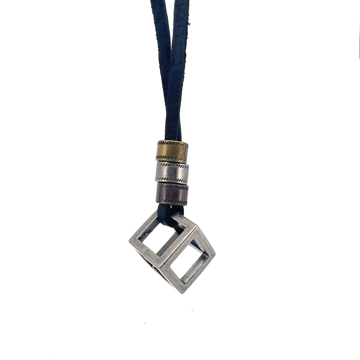 Necklace with a metallic cube-shaped pendant on a dark cord.