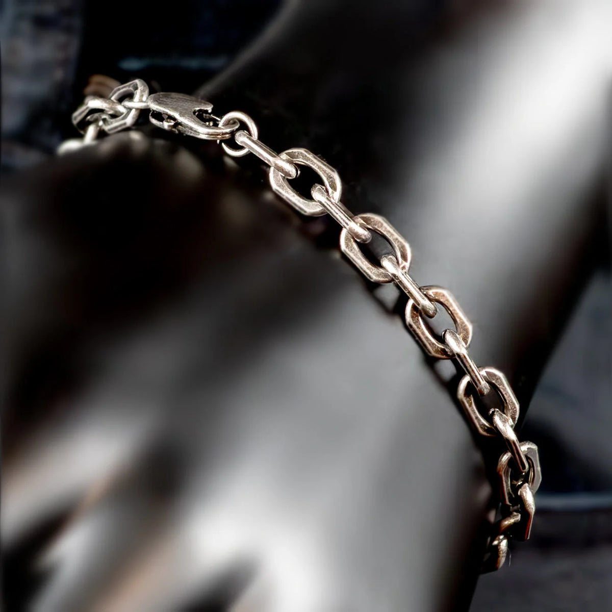 Silver chain bracelet with oval links.