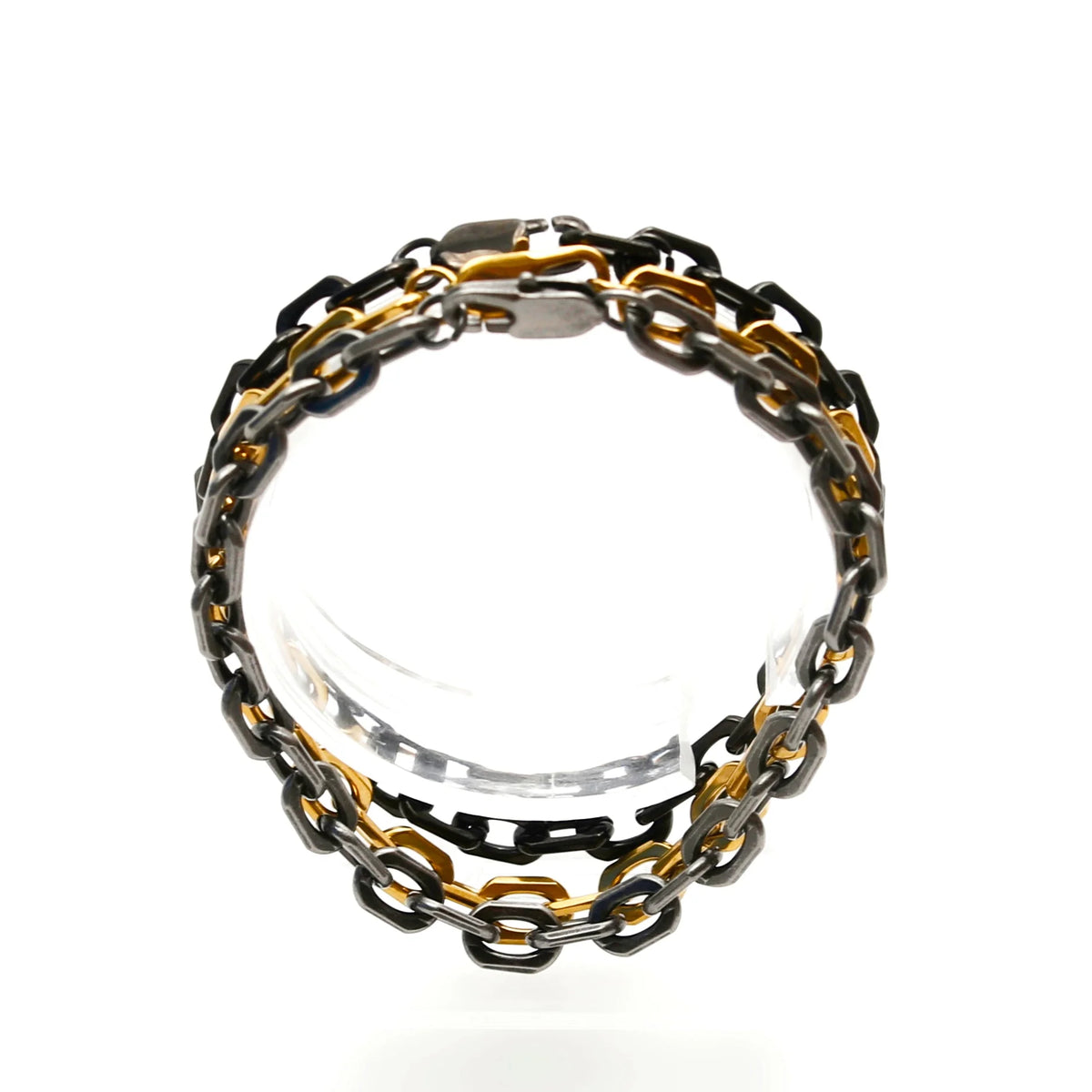 Chain-link bracelet with alternating gold, silver, and black metal links.