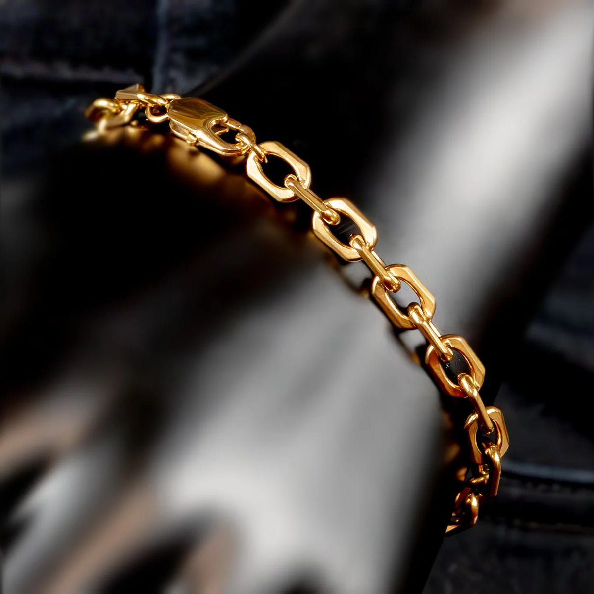 Gold chain bracelet with interlocking oval links.