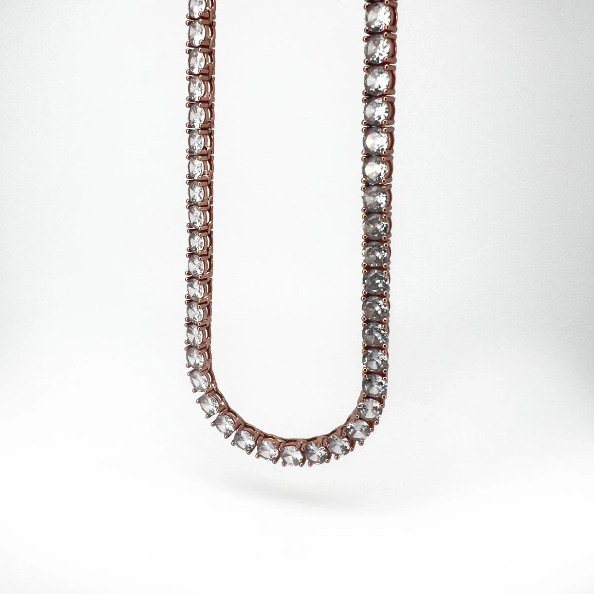 Rose gold tennis necklace.