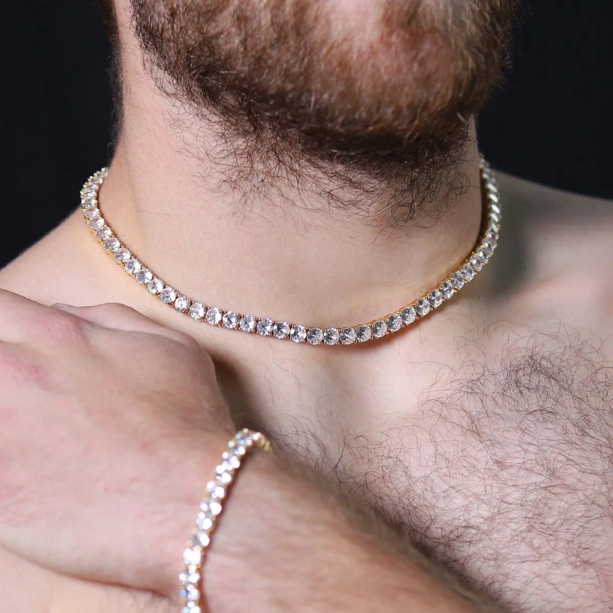 Diamond tennis necklace worn around a person’s neck.