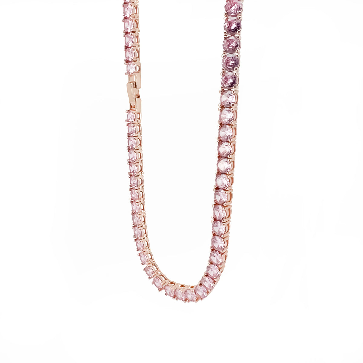 Pink gemstone tennis necklace with rose gold setting.