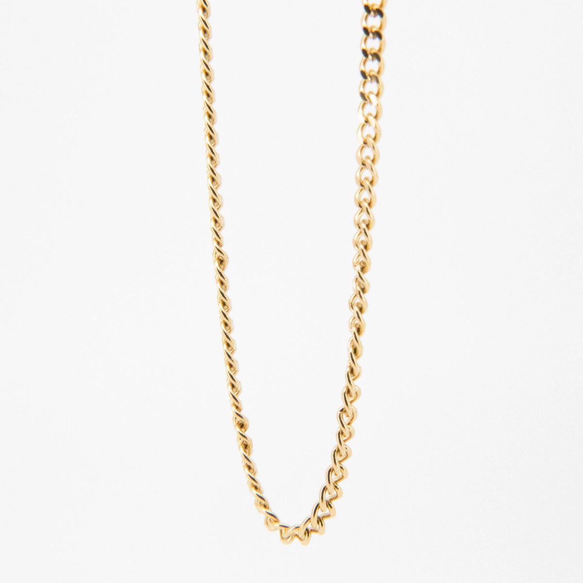 Gold chain necklace with twisted rope-style links.