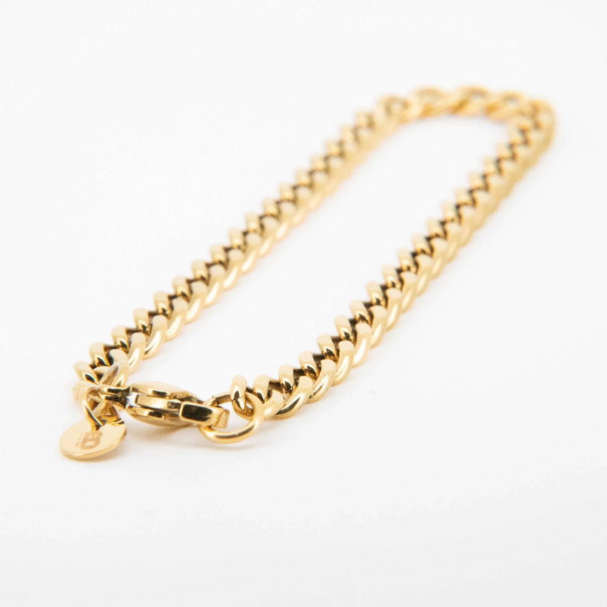 Gold-toned chain bracelet with a curb link pattern.