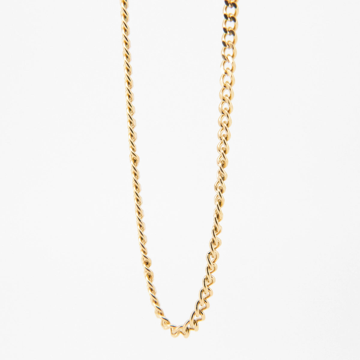 Gold chain necklace with twisted links.