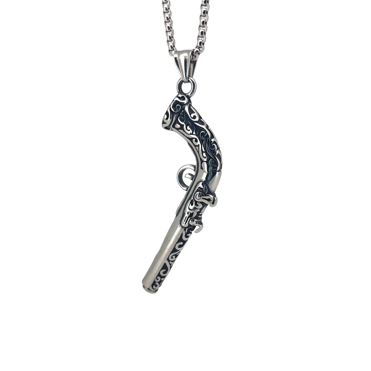 Ornate silver pistol-shaped pendant on a chain necklace.