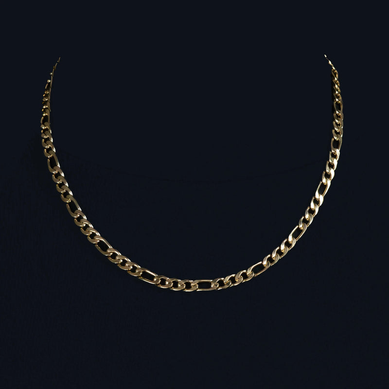 Gold chain necklace with alternating link sizes.