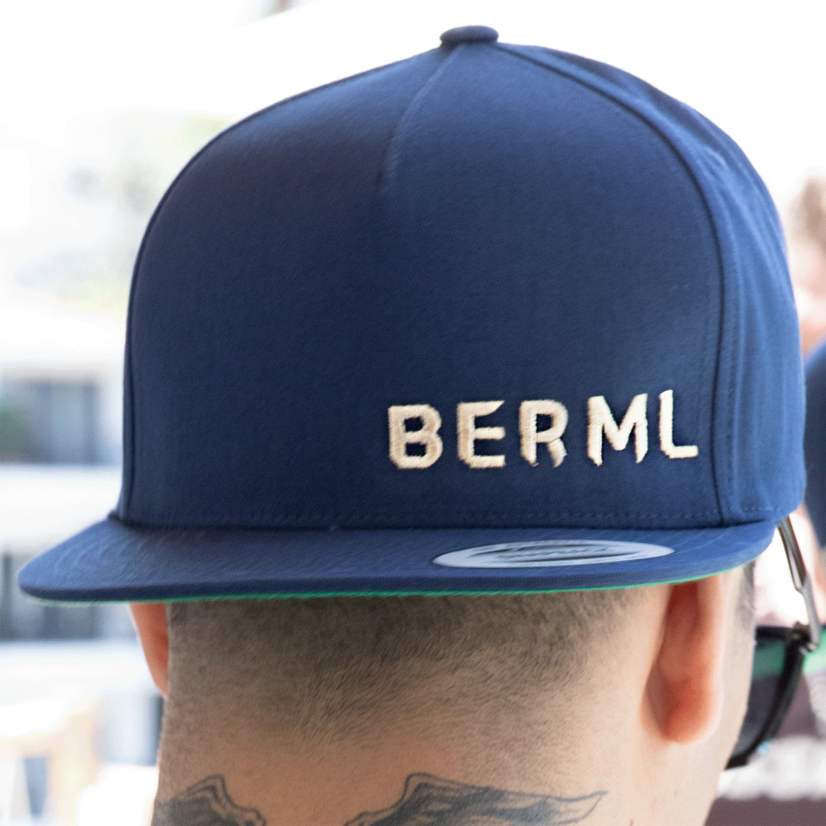 Navy blue baseball cap with ’BERML’ embroidered in white on the front.