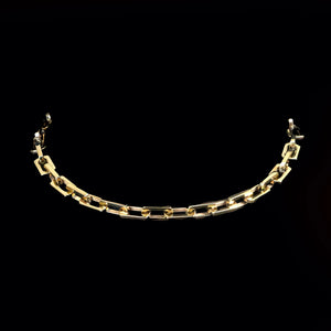 Gold chain bracelet with rectangular links.