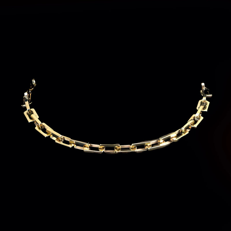 Gold chain bracelet with rectangular links.