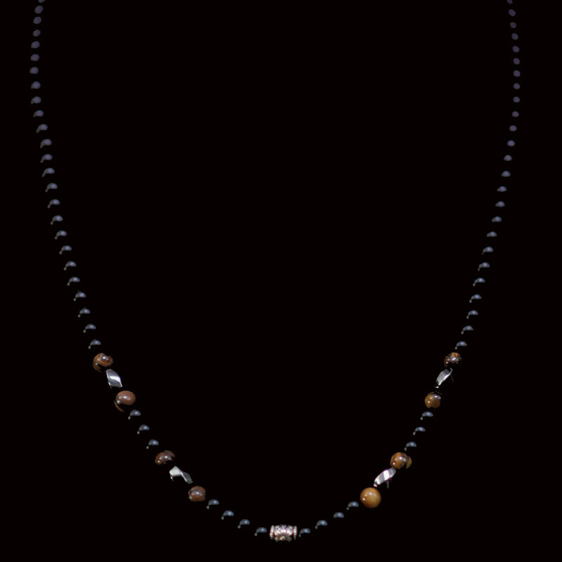 Beaded necklace with black, brown, and metallic elements.