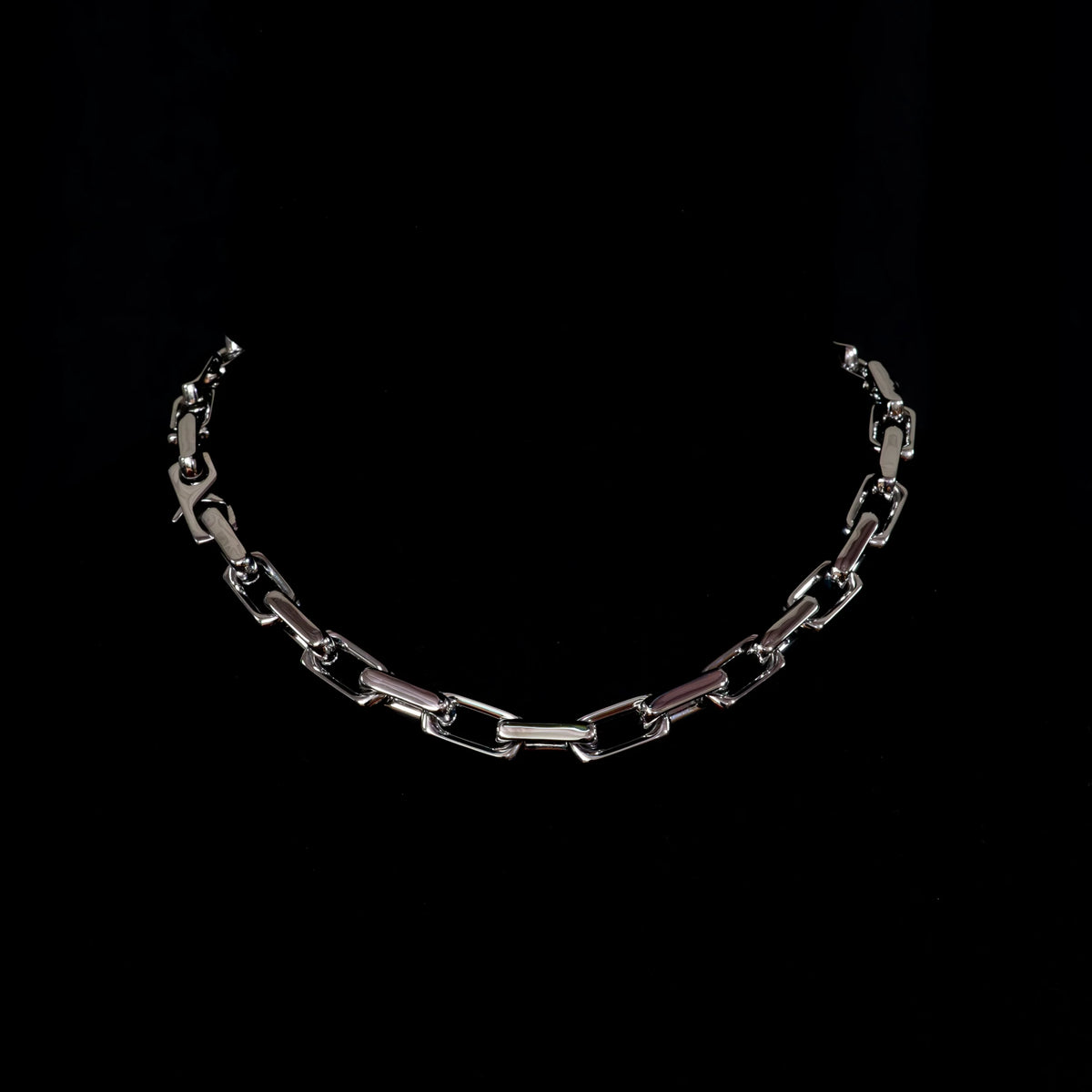 Silver chain necklace with connected oval links.