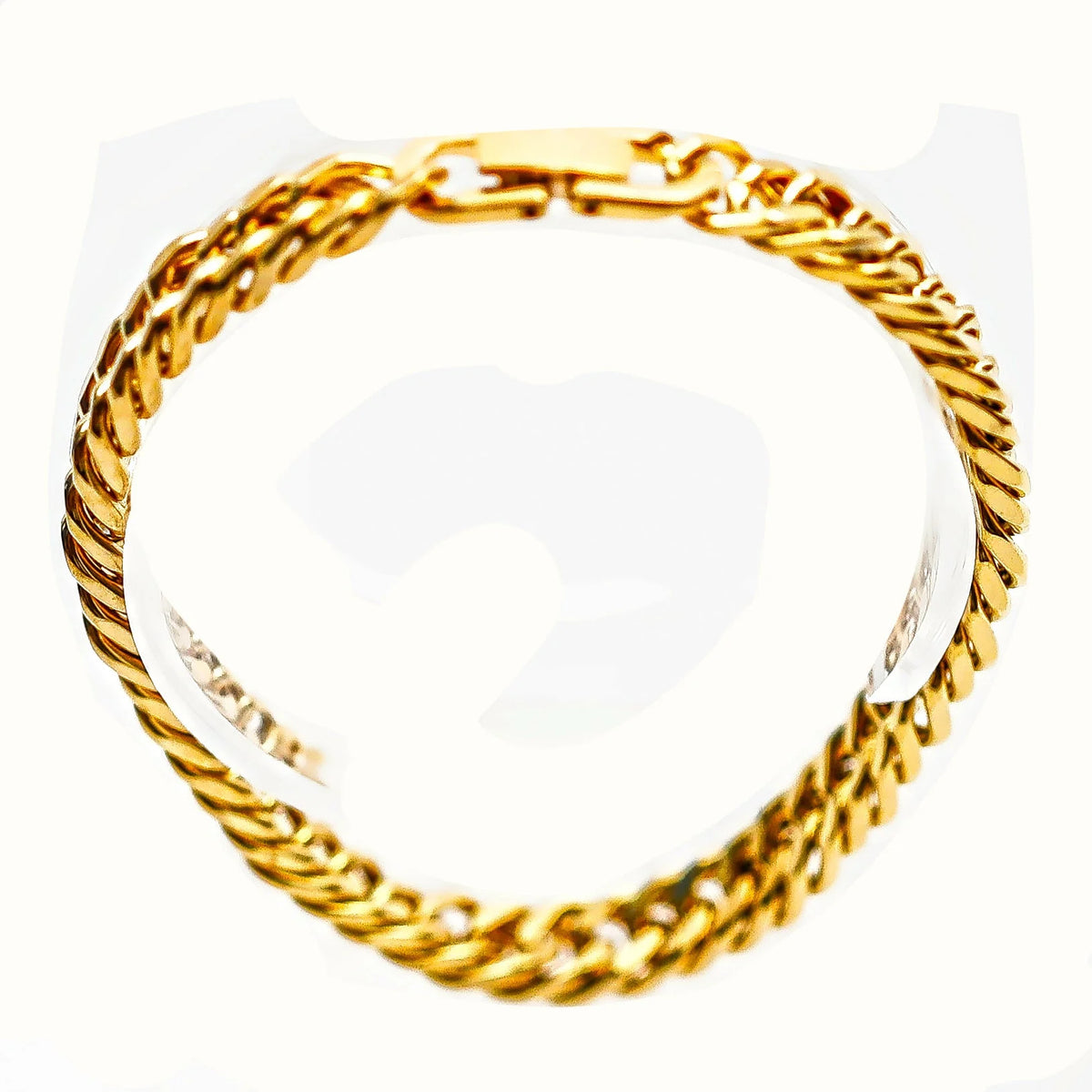 Gold chain bracelet with twisted links.