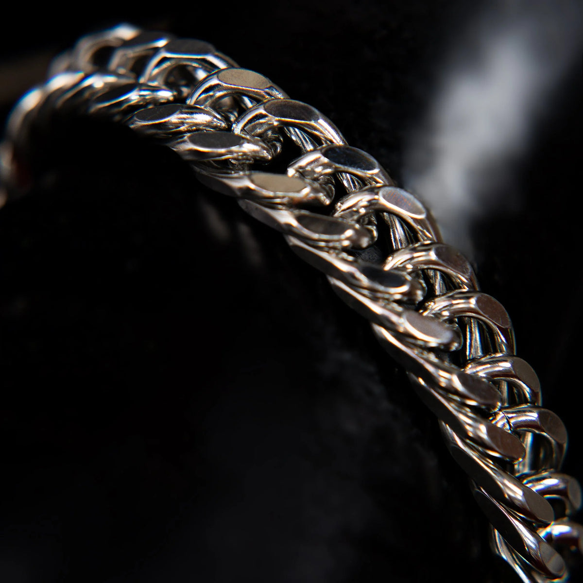 Silver chain bracelet with interlocking links.