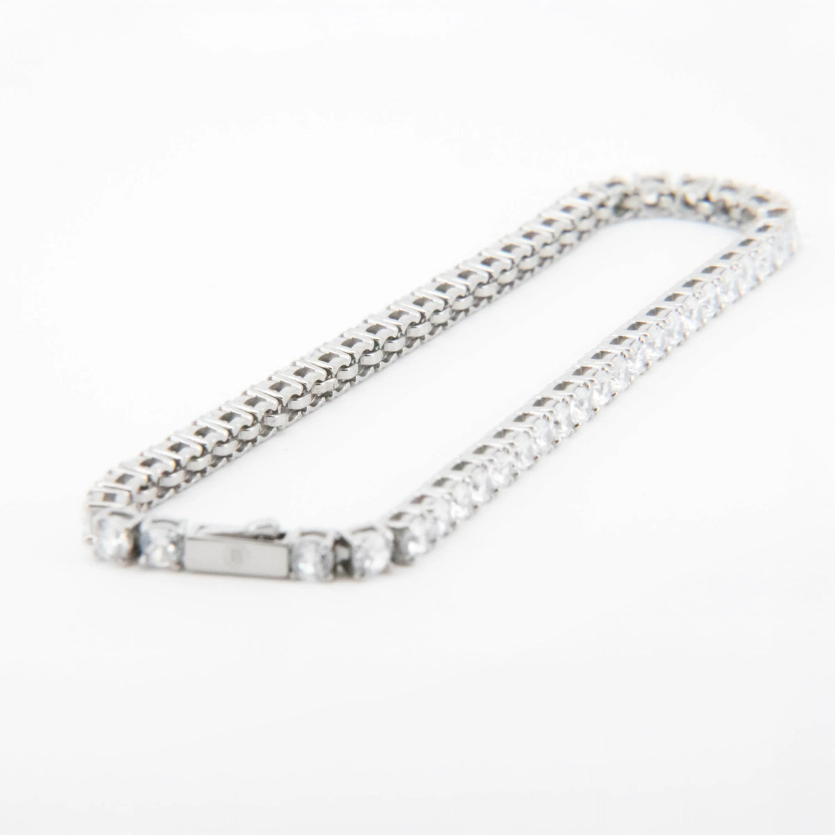 Silver chain bracelet with cubic zirconia stones.