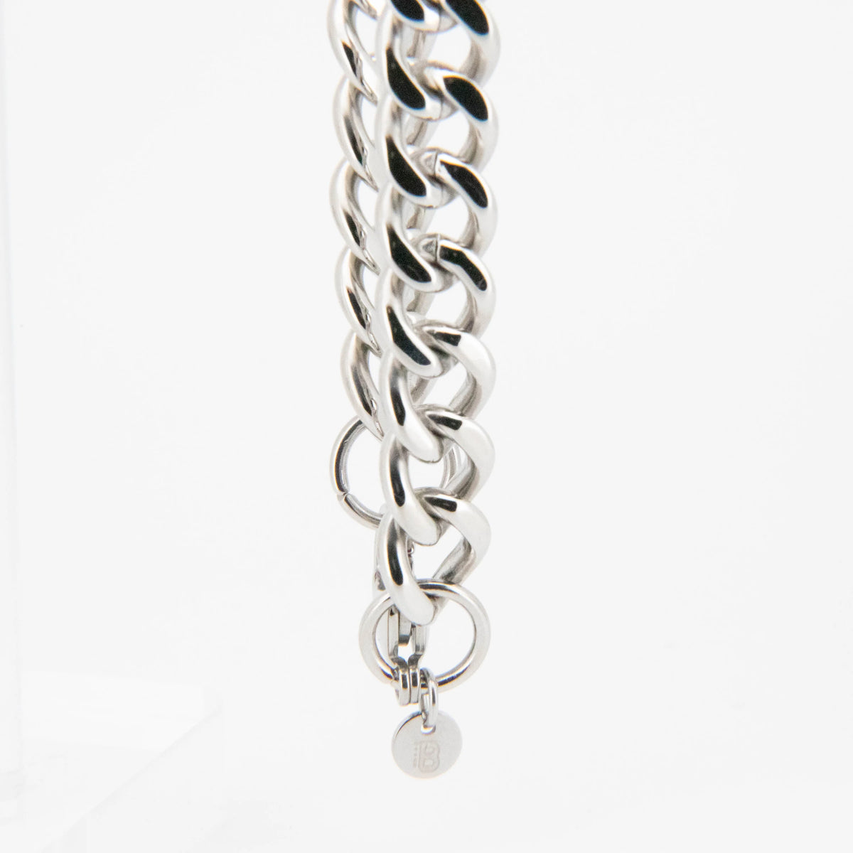 Silver chain bracelet with interlocking circular links.