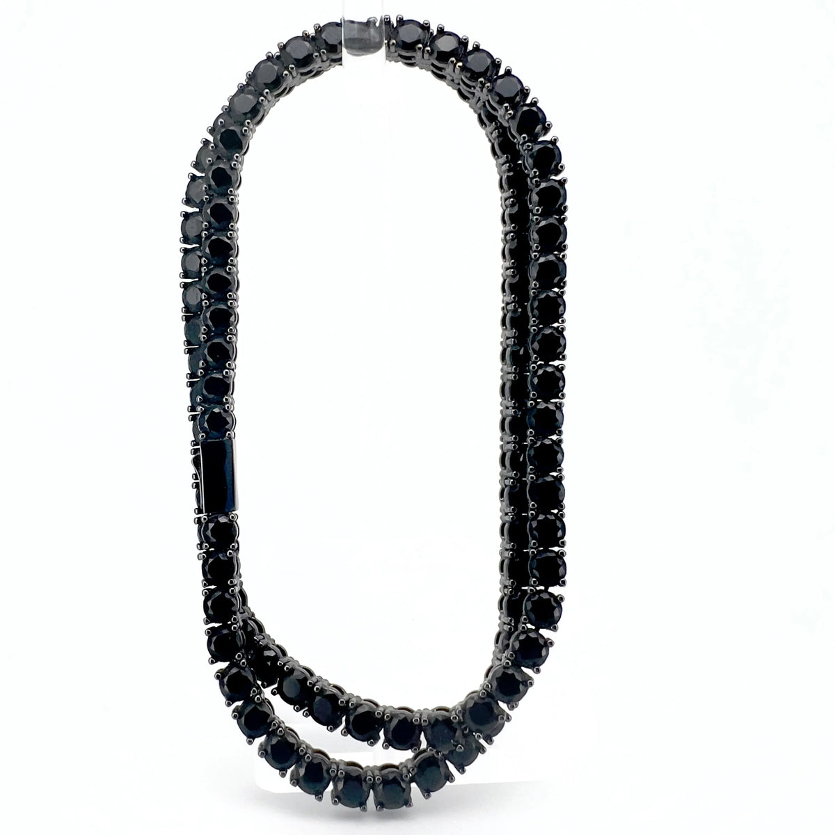 Elegant black gemstone necklace with graduated round stones set in a double-strand design.