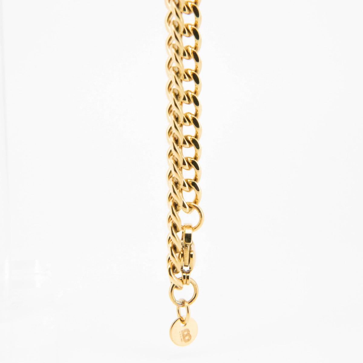 Gold chain bracelet with interlocking links.