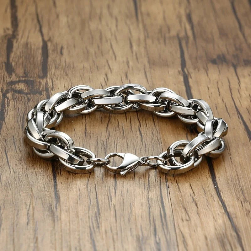 Silver chain bracelet with thick interlocking links and a clasp.