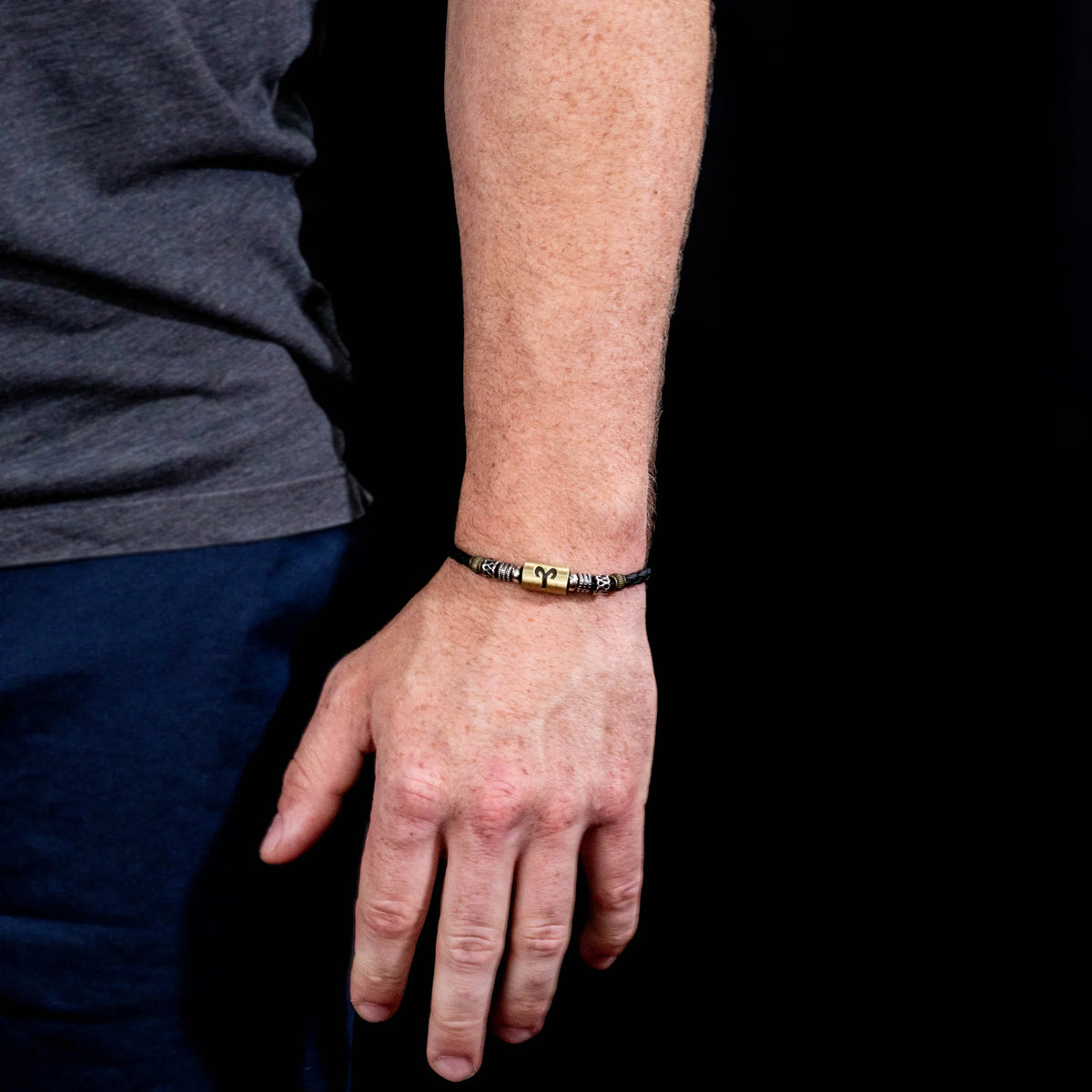 Beaded bracelet worn on a wrist.