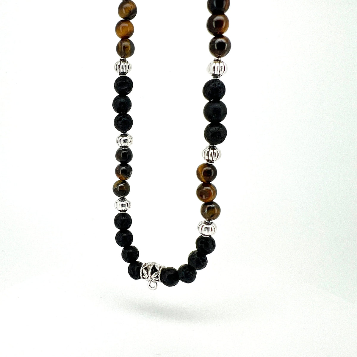 Beaded necklace featuring black, brown, and silver-colored spherical beads.