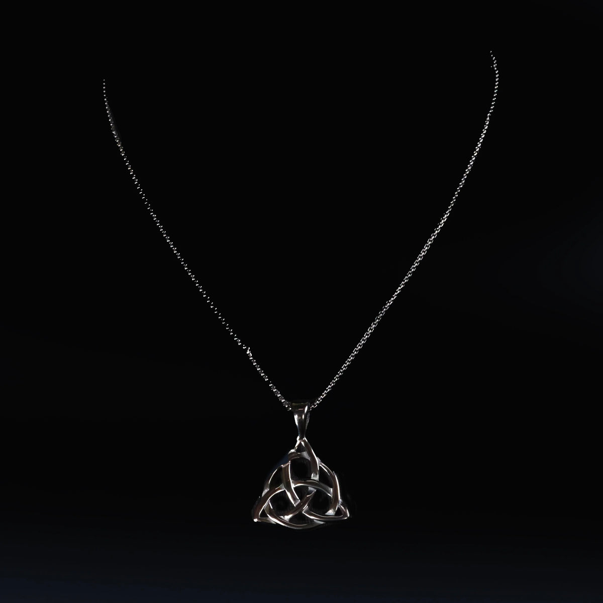 Silver necklace with a Celtic trinity knot pendant.