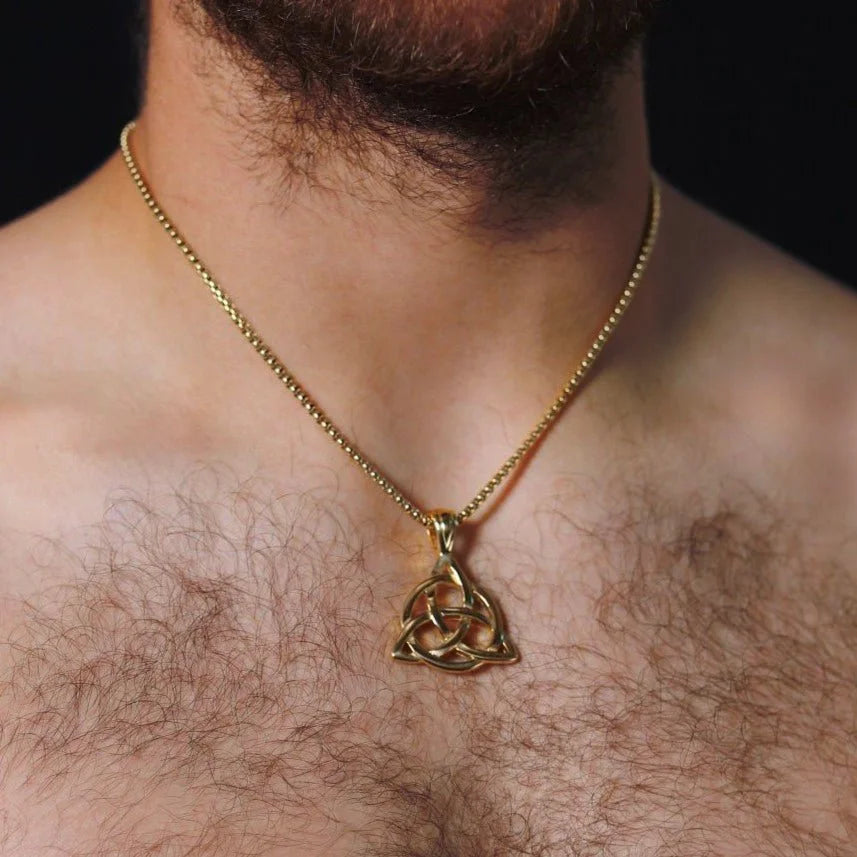 Gold pendant necklace featuring a Celtic trinity knot design.