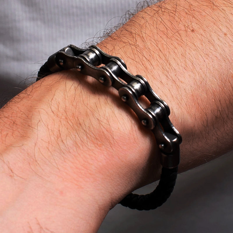 Bracelet made from a bicycle chain worn on a person’s wrist.