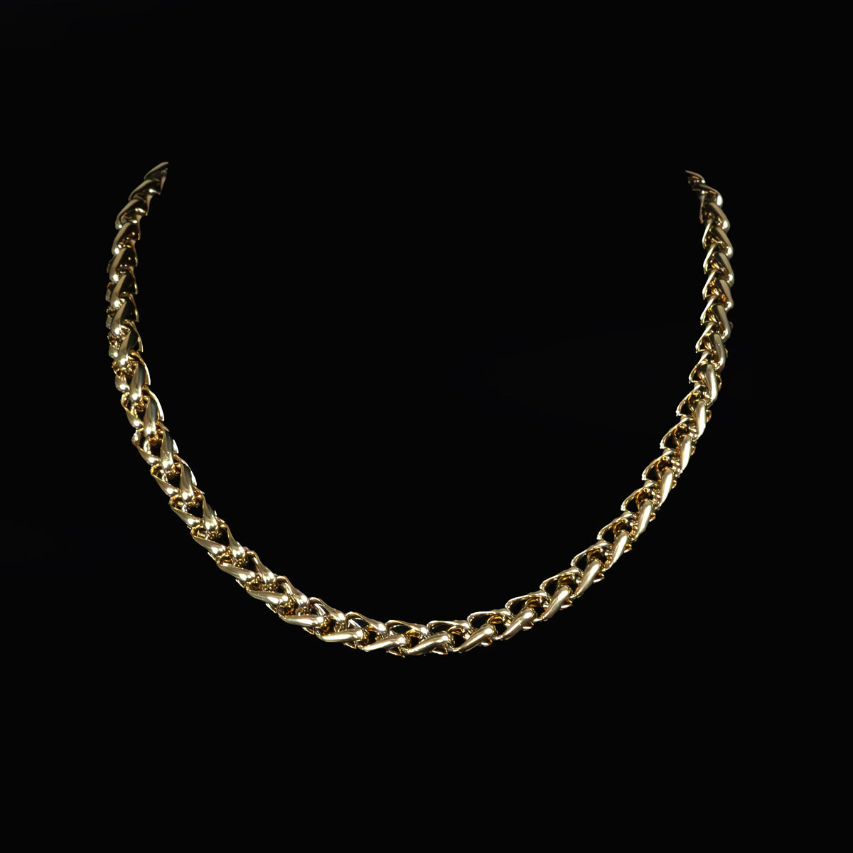 Gold chain necklace with interlocking links.