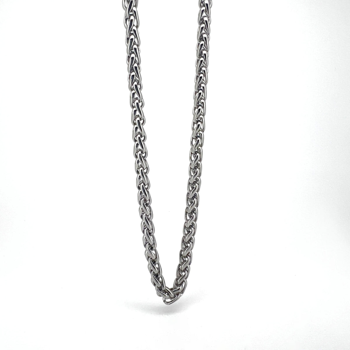 Silver chain necklace with an intricate braided pattern.