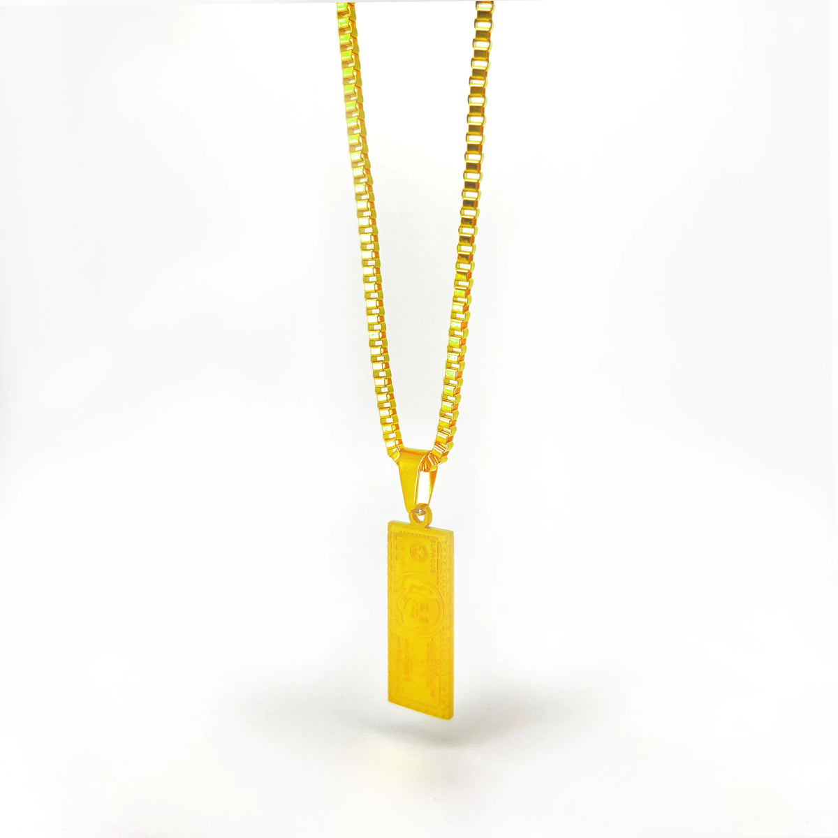 Gold pendant necklace with a rectangular bar charm.