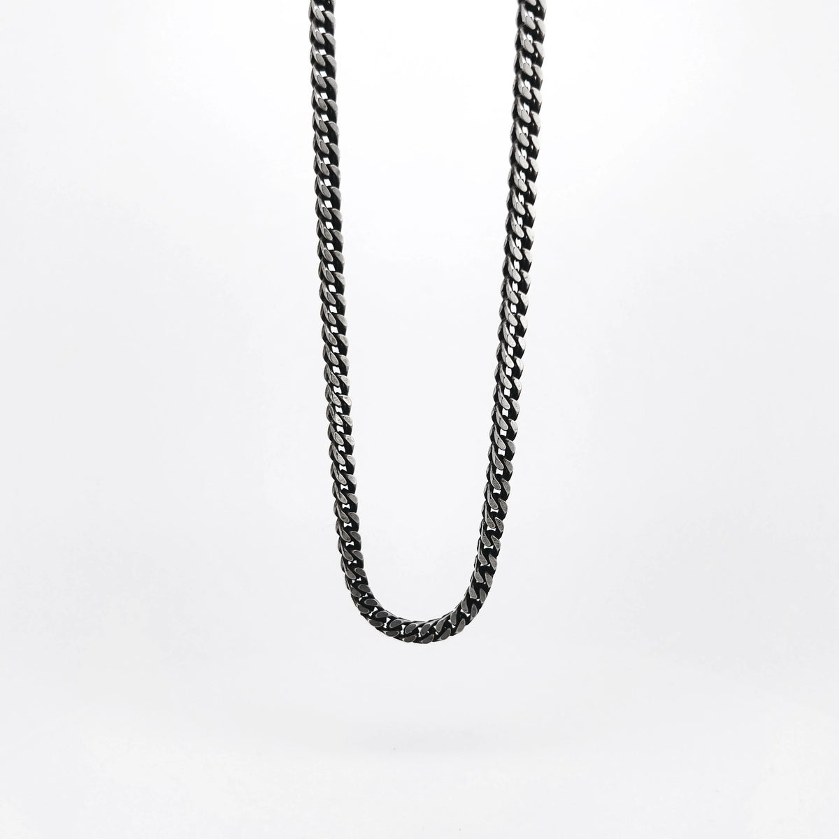 Silver or gunmetal-colored chain necklace with interlocking links.