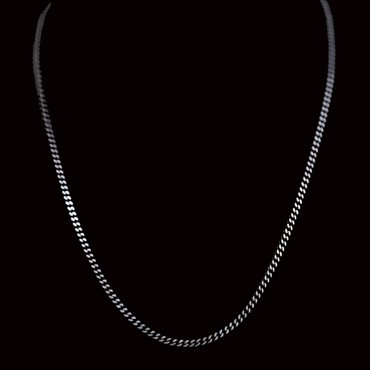 Silver chain necklace with small interlocking links.