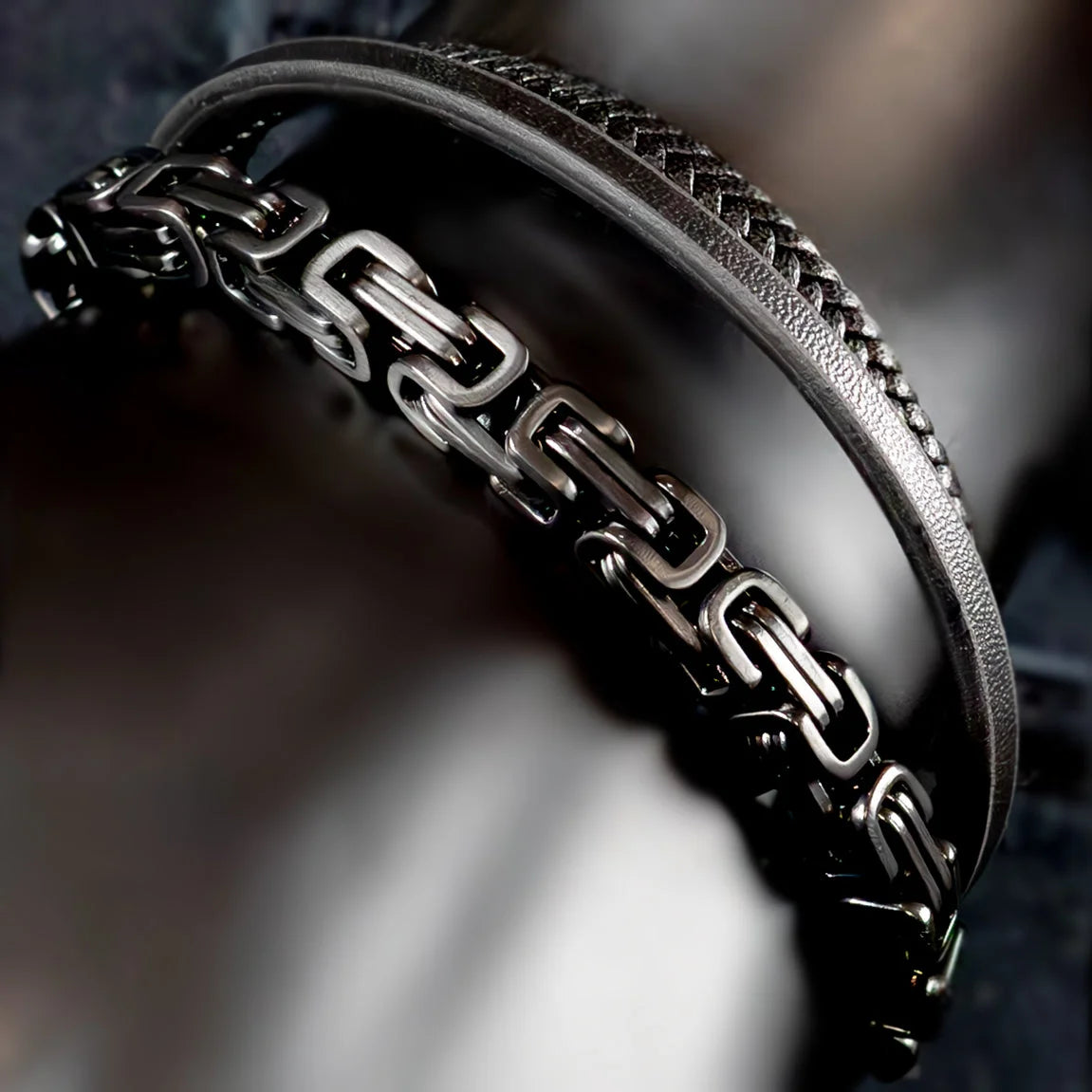 Stylish men’s bracelet with interlocking metal links and a leather band.