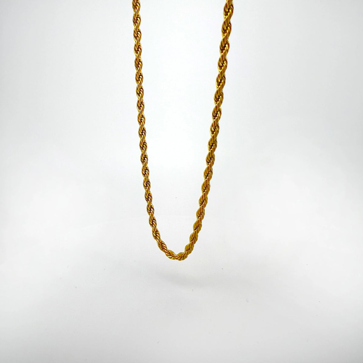 Gold rope chain necklace.