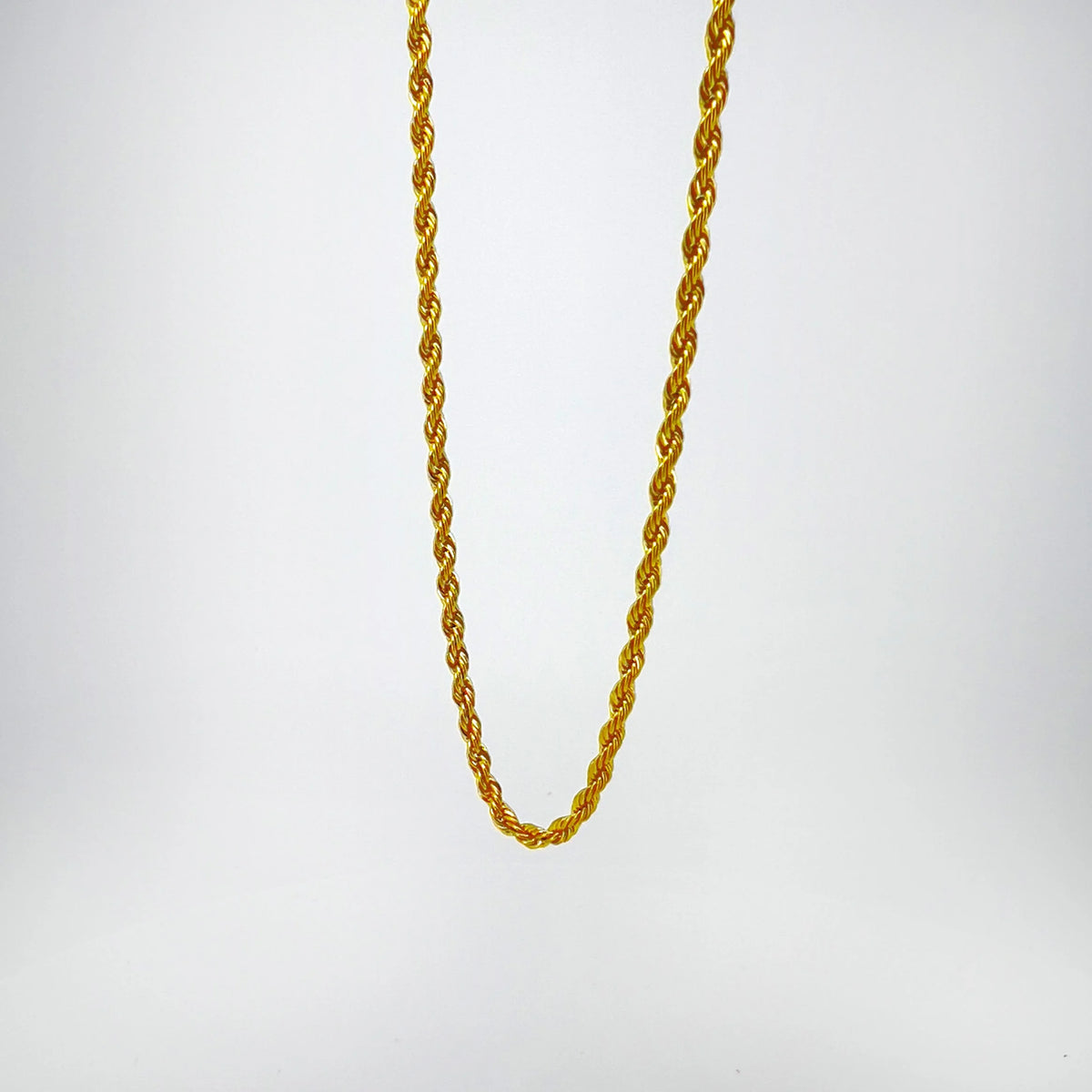 Gold twisted rope chain necklace.