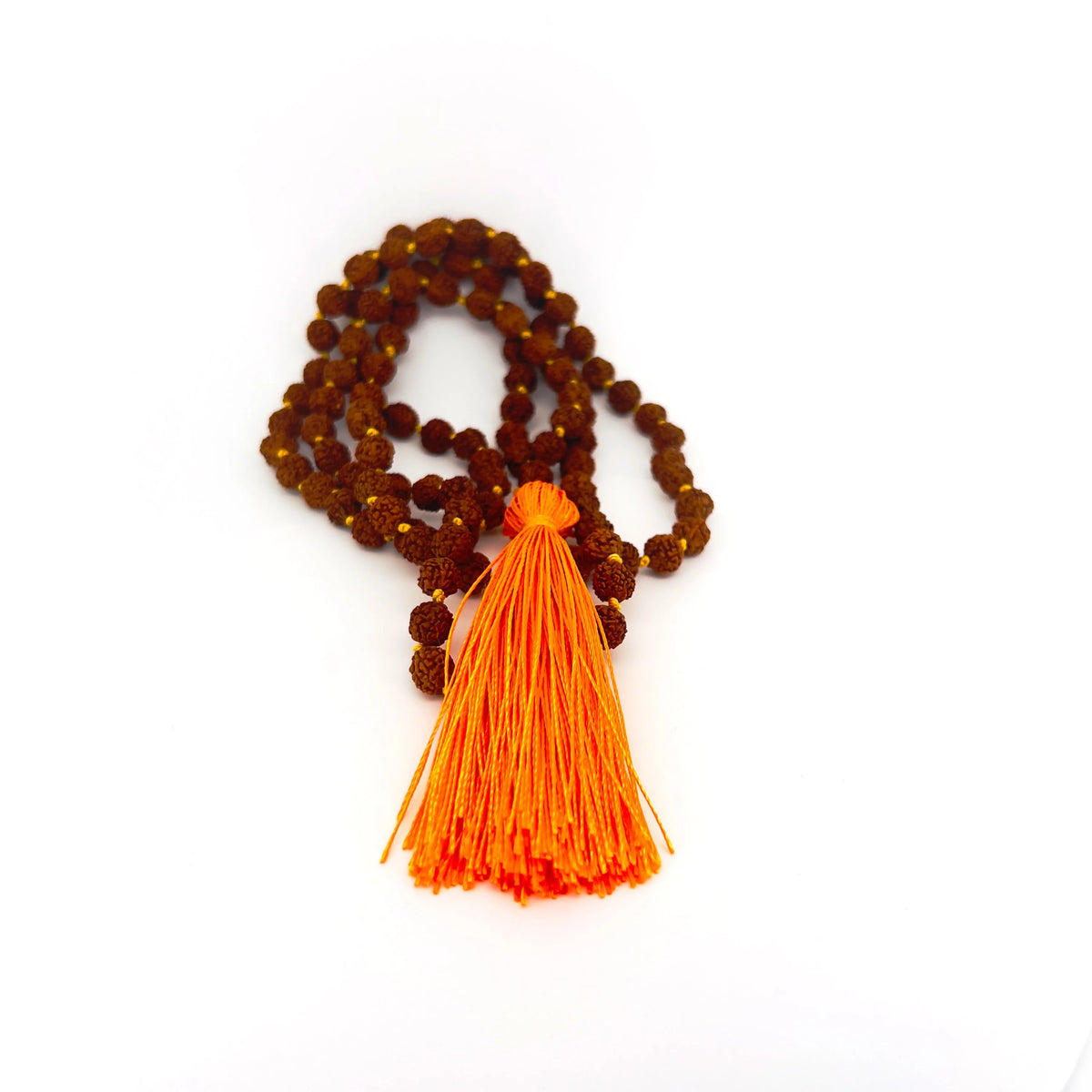 Rudraksha bead necklace with an orange tassel.