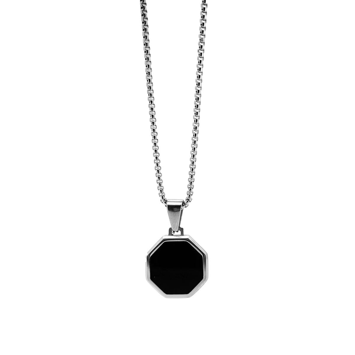 Silver necklace with an octagonal black pendant.