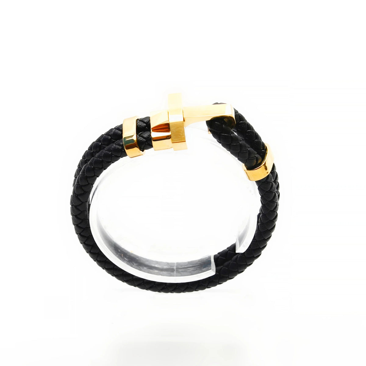 Black leather bracelet with gold-colored metal accents and clasp.