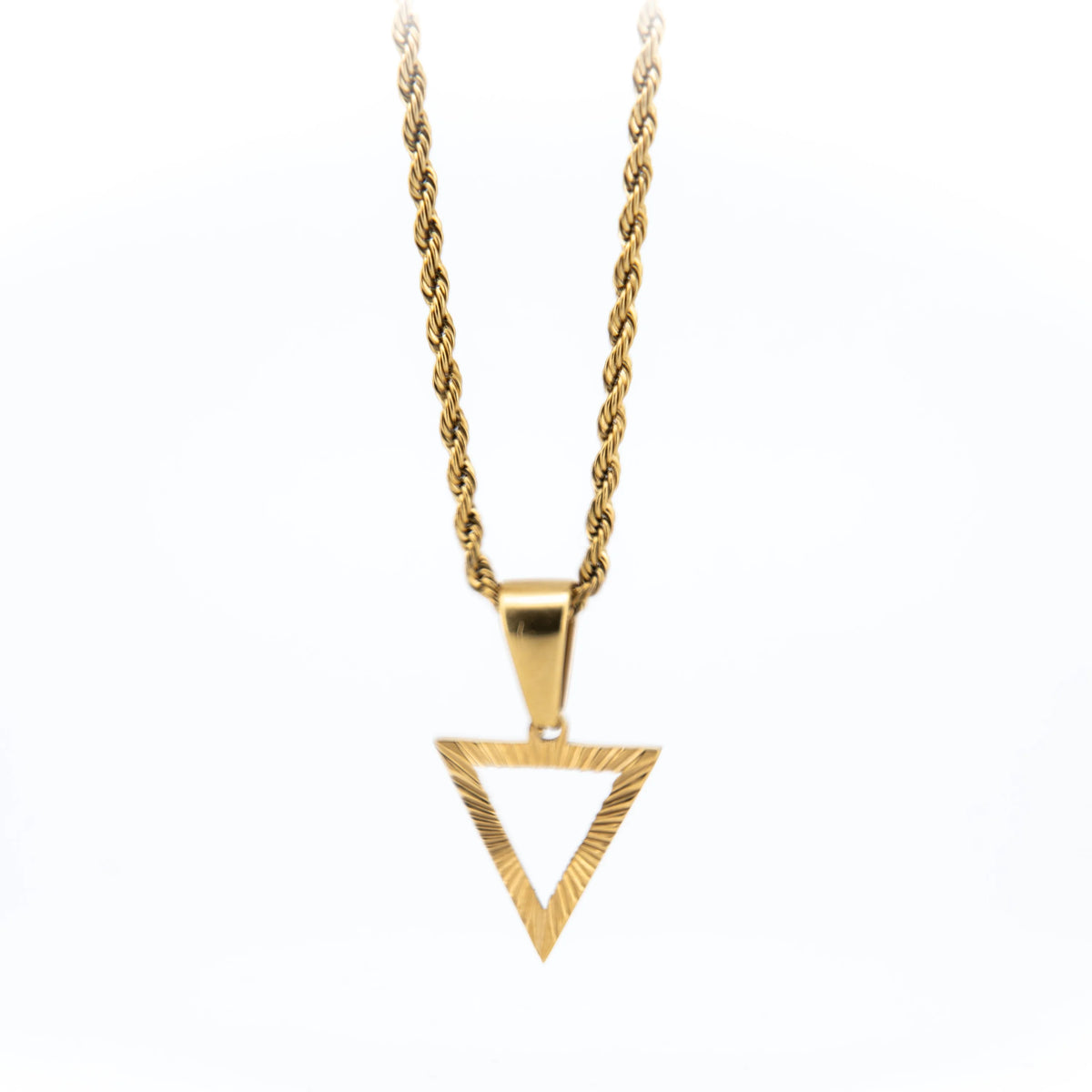 Gold necklace with a triangular pendant on a twisted chain.