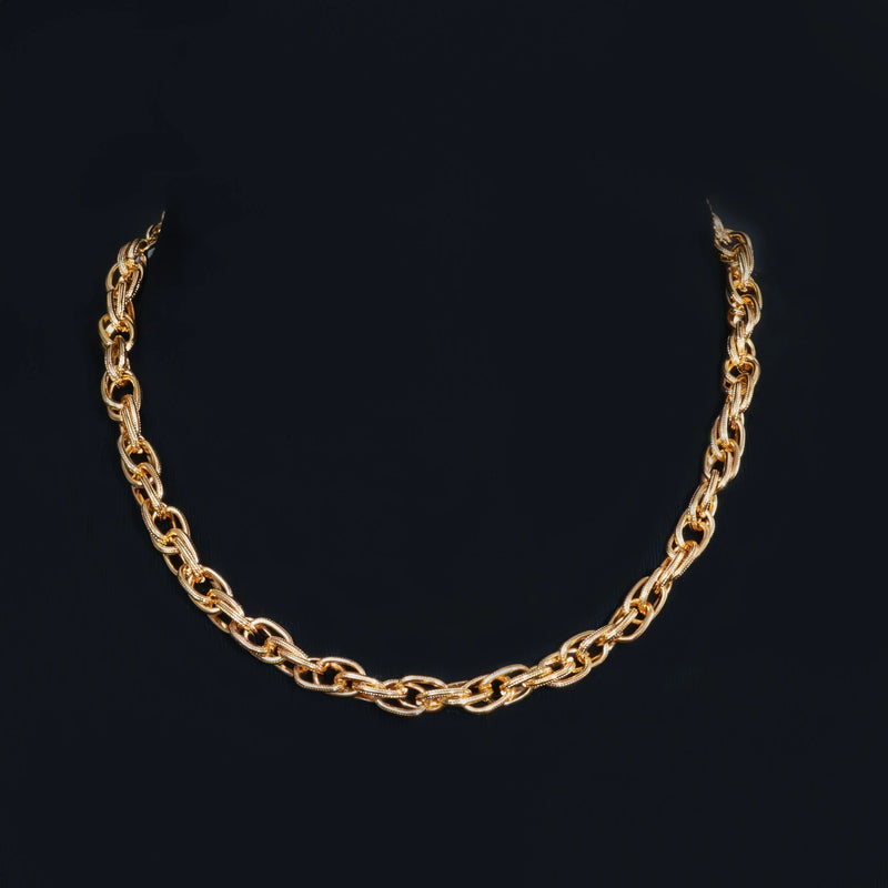 Gold chain necklace with interlocking oval links.