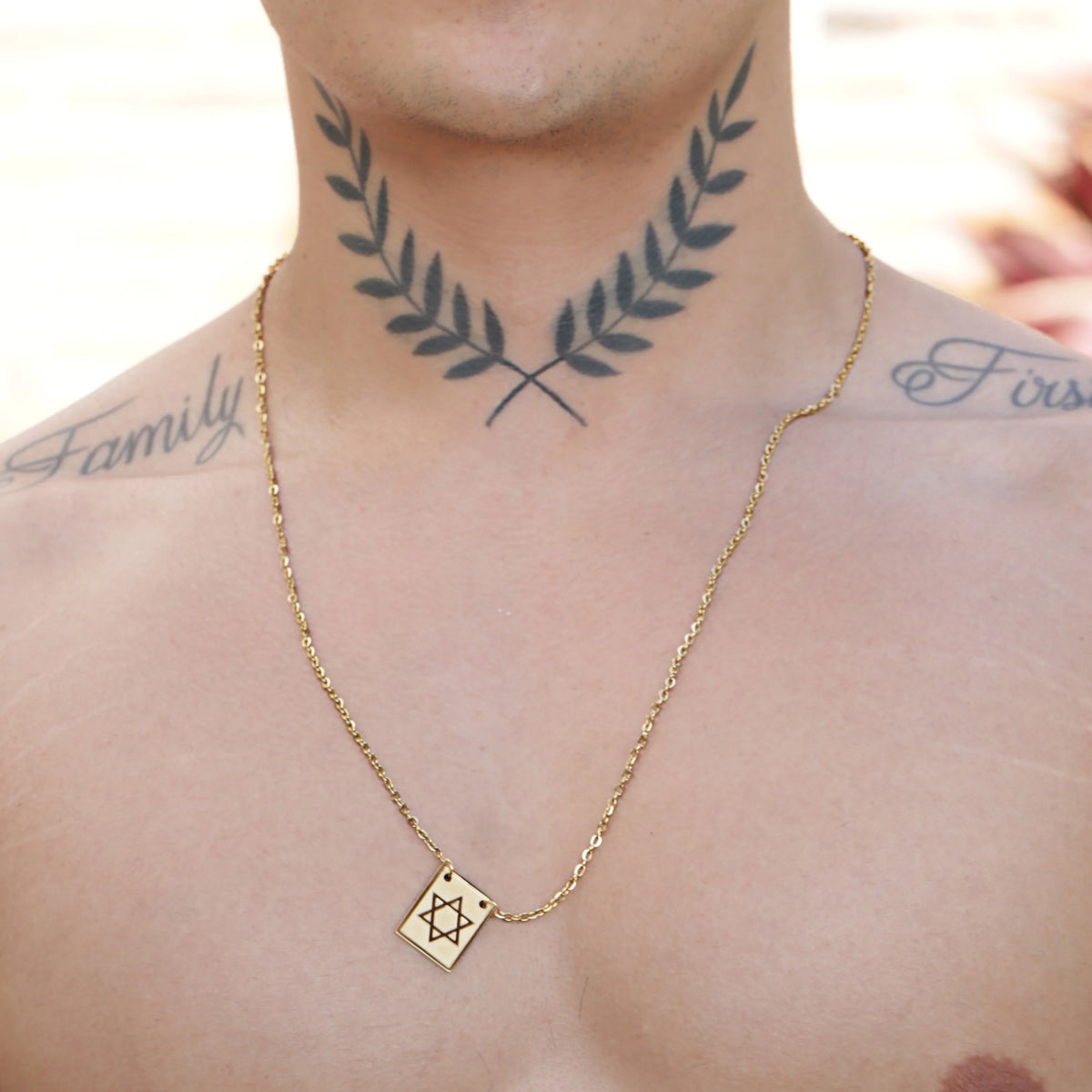 Gold necklace with a Star of David pendant.