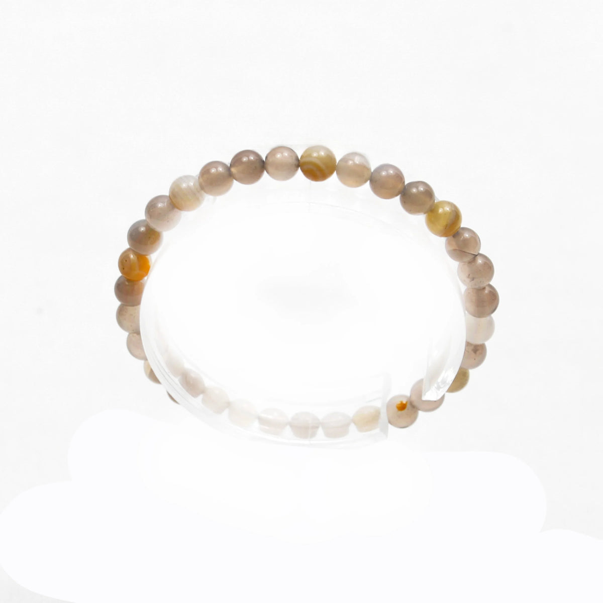 Beaded bracelet with translucent stones in various shades of beige and amber.