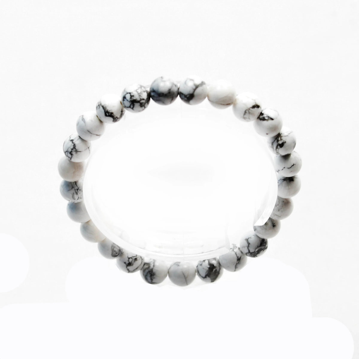 Bracelet made of white and gray marbled beads.