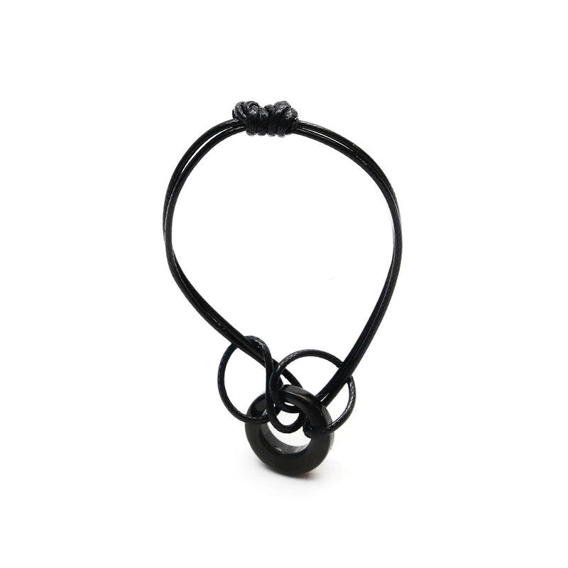 Black cord necklace with interlocking rings as a pendant.